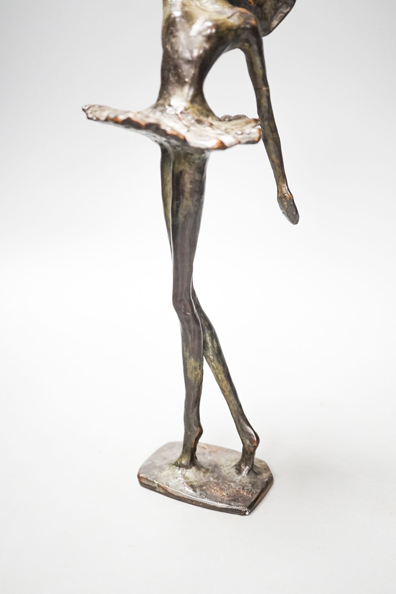 A 20th century bronze figure of a ballerina, indistinctly initialled CAN (?), 33cm